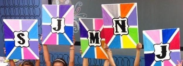 Colorful painted monogram canvases
