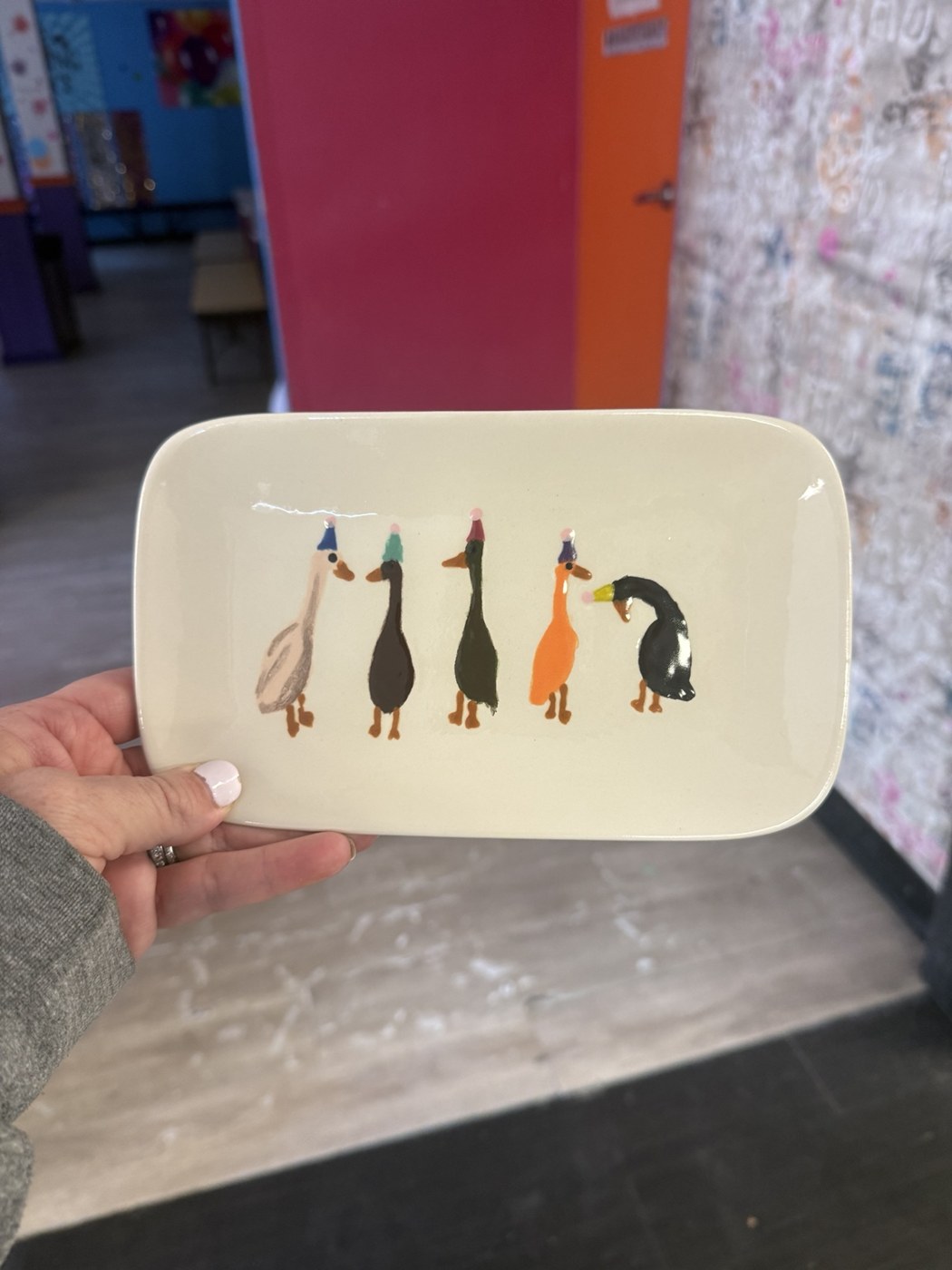 Hand-painted ceramic tray decorated with colorful cats