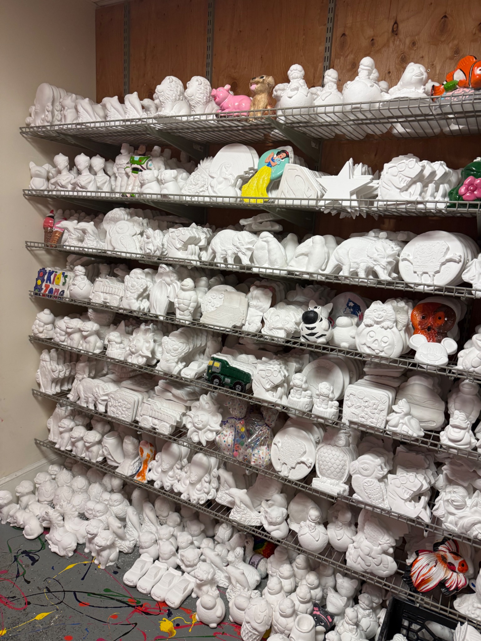 Shelves full of plaster shapes and letters ready to paint