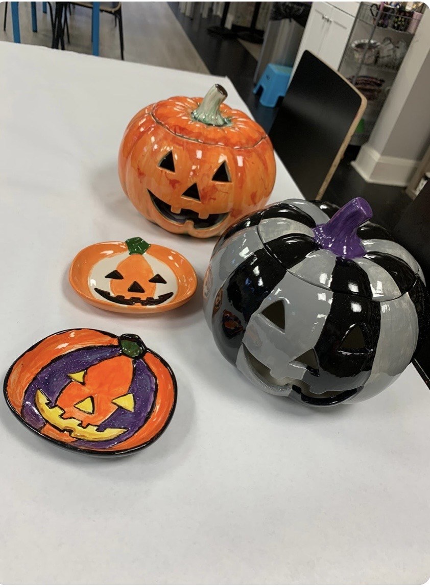 Hand-painted ceramic pumpkins and Halloween plates at The Painting Place in Wellesley, MA