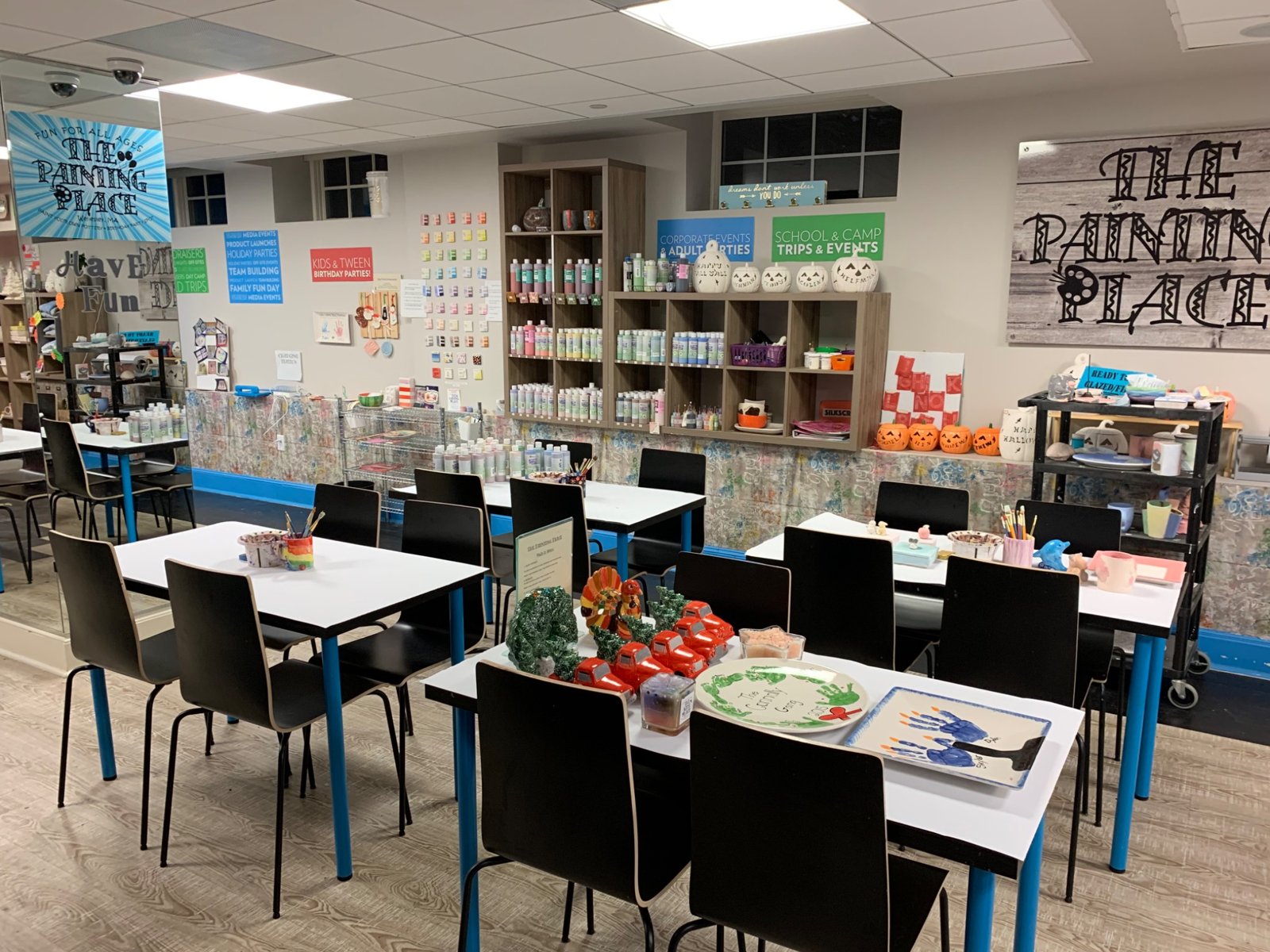 Paint stations and colorful finished pottery at The Painting Place